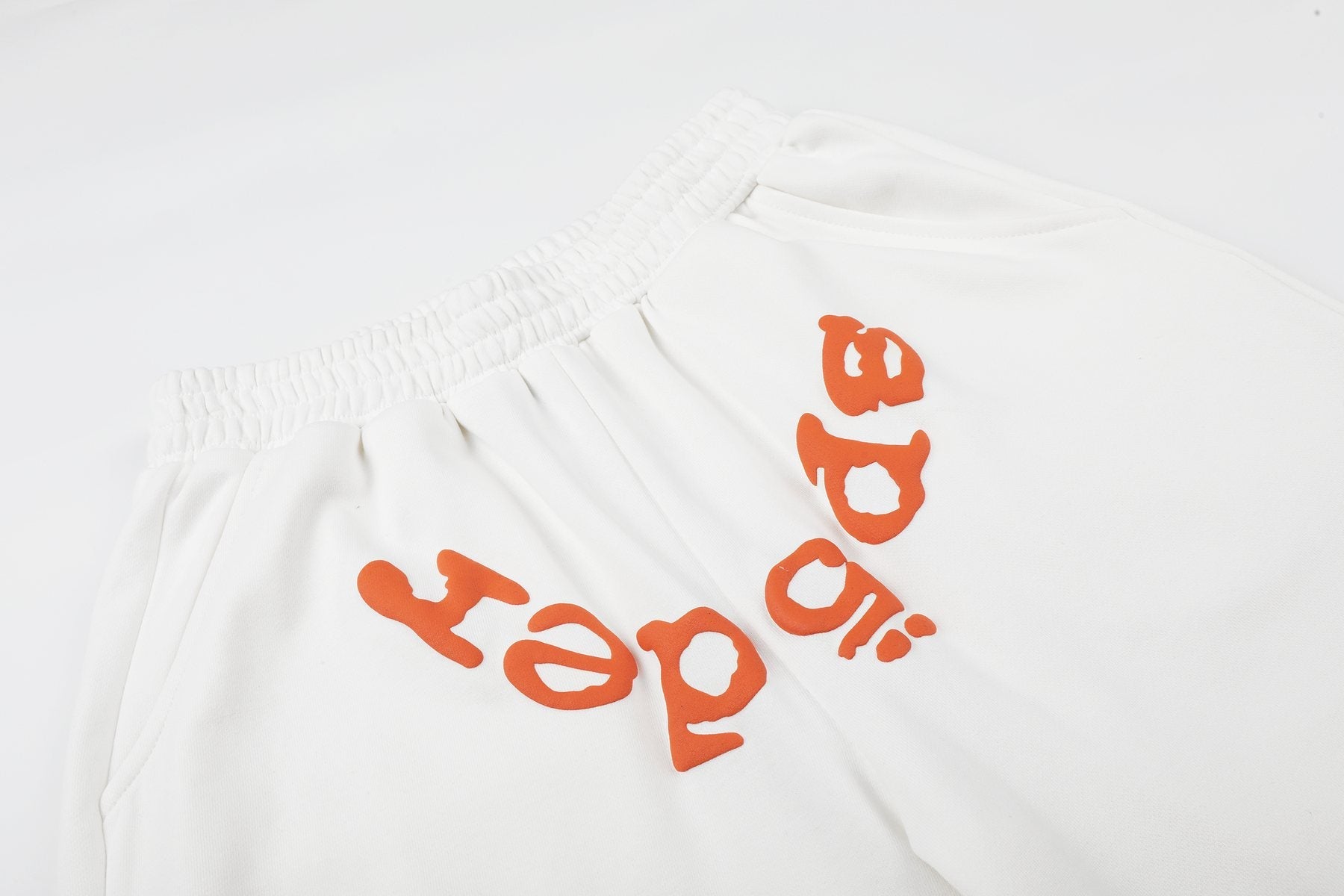Sp5der Raised Graphic Raw Hem Shorts — detail