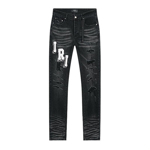AMIRI Varsity Letter Appliqué Distressed Jeans — front