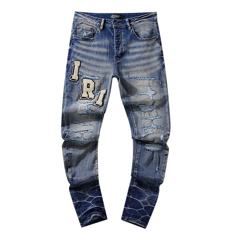 AMIRI Varsity Letter Appliqué Distressed Jeans — hero
